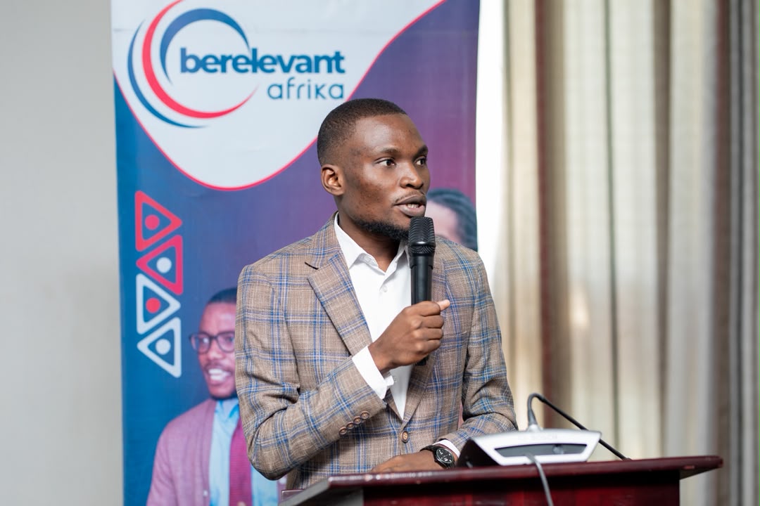 A young Zambian speaker addressing an audience at a BeRelevant Afrika event